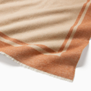 Throw blanket in Sand and Rust colors
