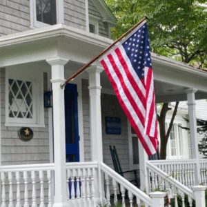 Flag on 48 inch flagstaff outside of home